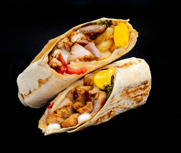 istock Beef shawarma on a dark background. Shawarma with beef in pita bread 1421688502