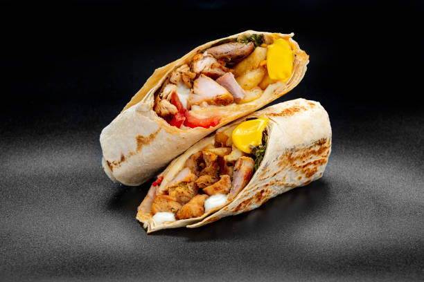 istock Beef shawarma on a dark background. Shawarma with beef in pita bread 1421688508
