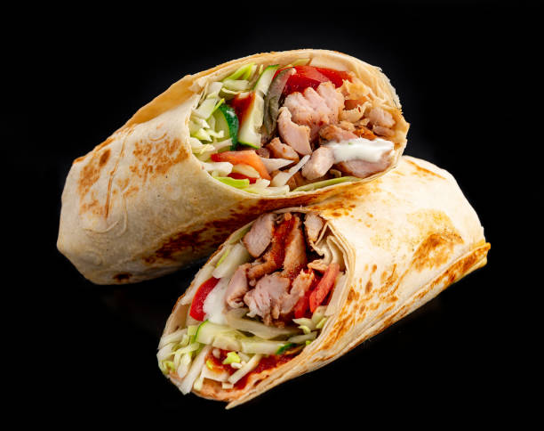 istock Beef shawarma on a dark background. Shawarma with beef in pita bread 1421688527