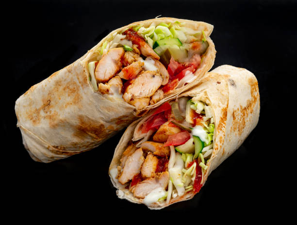 istock Beef shawarma on a dark background. Shawarma with beef in pita bread 1421688543