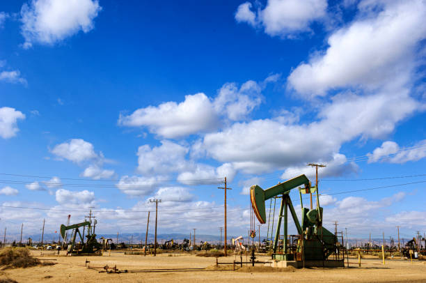 istock Oil Pumpjacks with Clouds in Background 1421697362