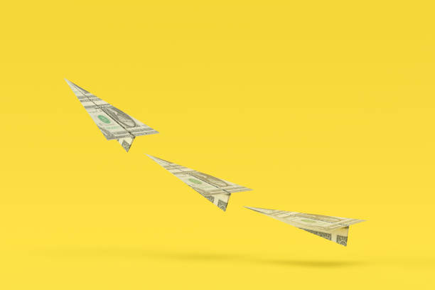 istock US Dollar Bill Paper Airplanes Moving Up 1421697695