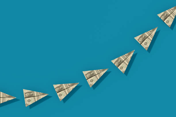 istock US Dollar Bill Paper Airplanes Moving Up 1421697916