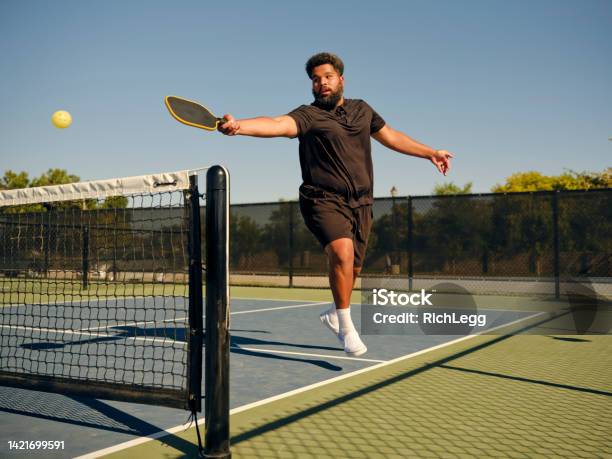 Young Adults Playing Pickleball On A Public Court Stock Photo - Download Image Now - 30-34 Years, Active Lifestyle, Adult