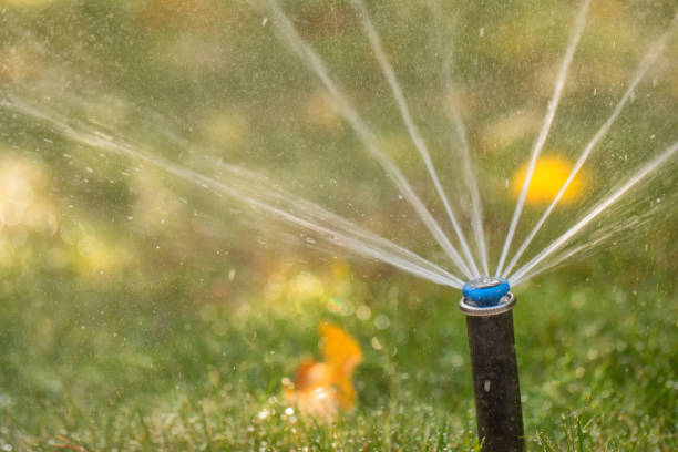 istock automatic sprinkler system watering the lawn close up 1421700256