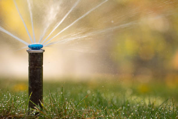 istock automatic sprinkler system watering the lawn close up 1421700271