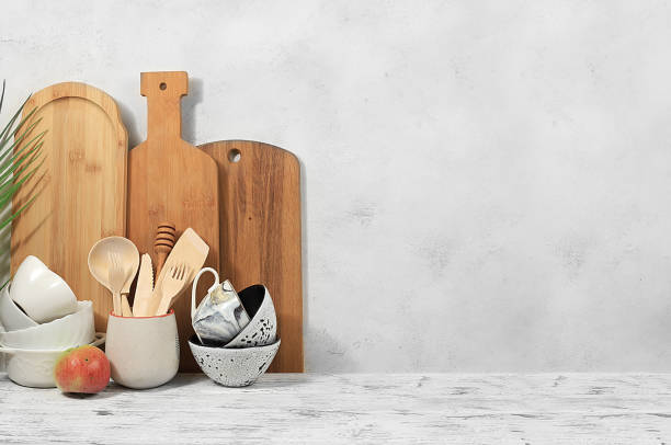 istock Empty rustic table with wooden cutlery, crockery.Simple home kitchen interior, mockup for product design and display, 1421700441