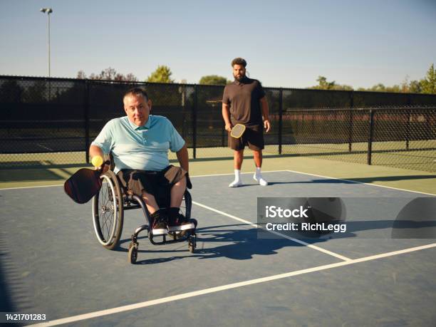 Young Adults Playing Pickleball On A Public Court Stock Photo - Download Image Now - Outdoors, Wheelchair, Wheelchair Tennis
