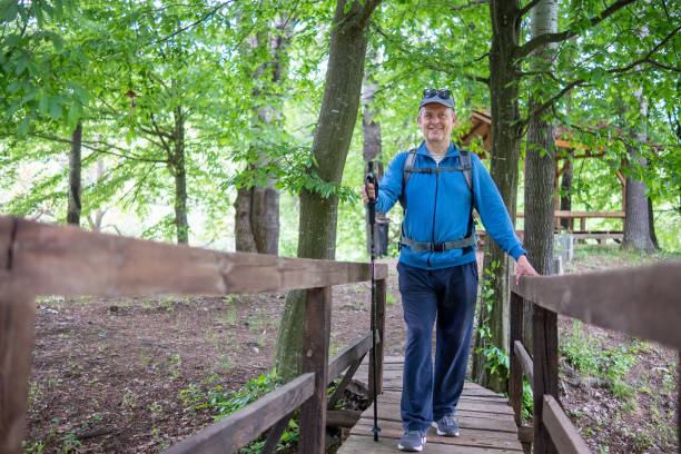 istock A middle-aged man is engaged in mountain tourism. 1421706776