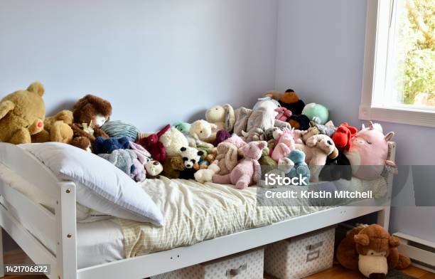 Childs Bedroom With Plush Toys Crowding The Bed Stock Photo - Download Image Now - Abundance, Animal, Animal Themes