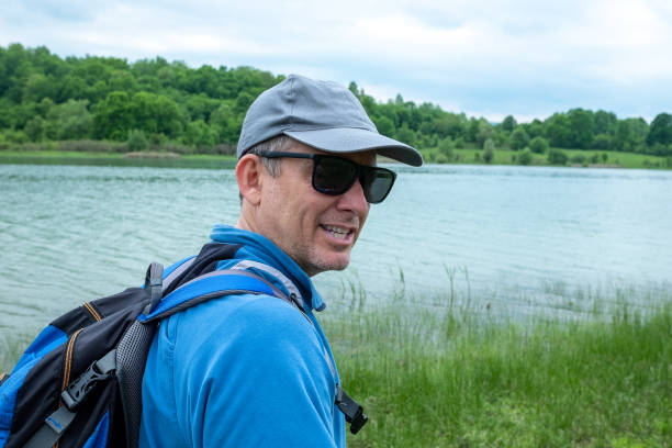 istock A middle-aged man is engaged in mountain tourism. 1421706828
