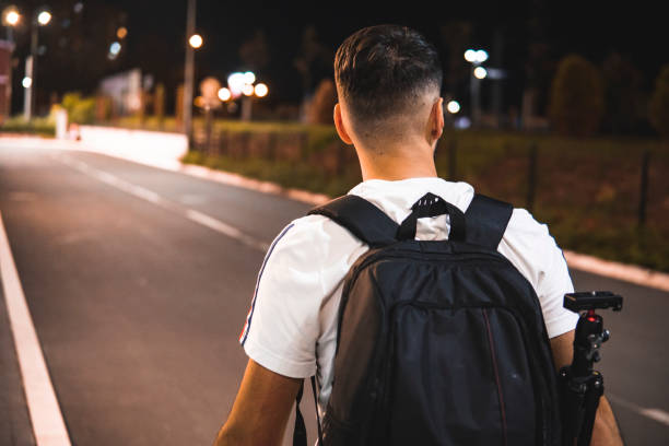 istock Caucasian guy walking down the street 1421713091
