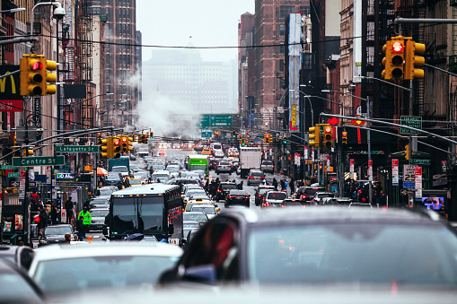 Yellow cab speeds through Times Square in New York, NY, USA.