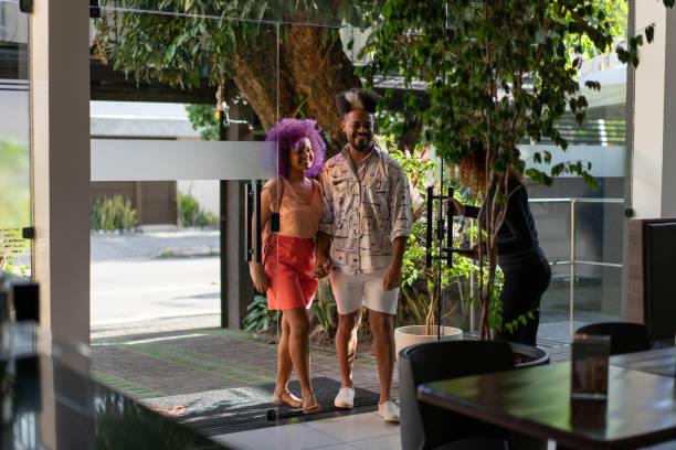 Afro couple entering the restaurant