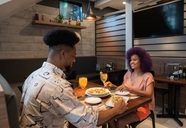 istock Afro couple in the restaurant 1421721047