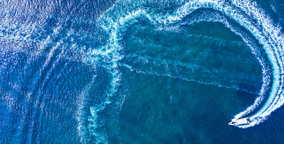 Full frame crisp detail of dark blue ocean wave