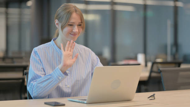 istock Woman Doing Video Call on Laptop in Office 1421724655