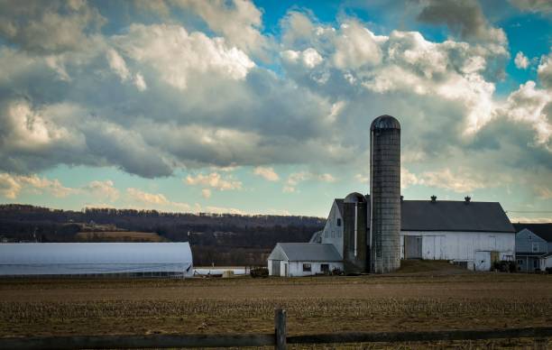 istock View of an Amish Farm, With Barn and Silo 1421728448
