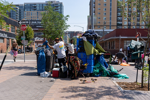 Denver, September 2022: Homeless of Denver live in tents on a street of city.