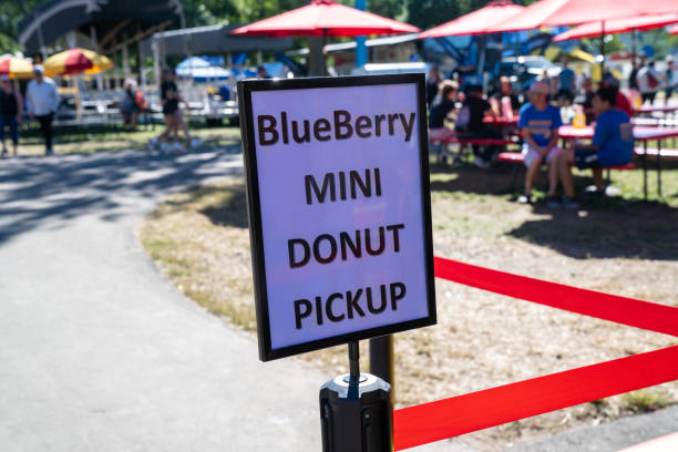 istock Sign for Blueberry Mini Donut pick up at the fair 1421733413