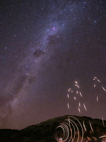 Light painting on a starry night