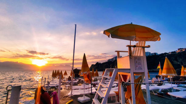 istock Sunset on the beach with lifeguard chair 1421736304