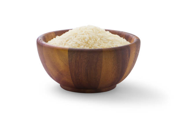 istock Rice in wooden bowl. 1421737561