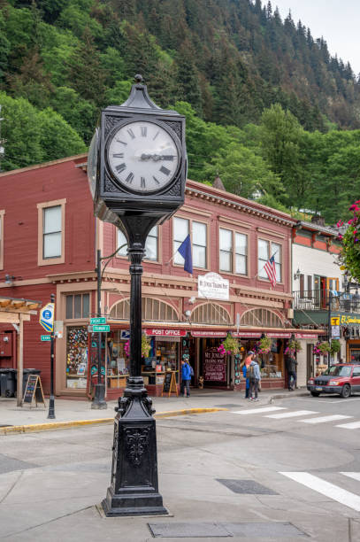 In the Center of Juneau, Alaska Juneau, Alaska - July 27, 2022: Central Juneau Alaska is home to many tourist shops, restaurants and landmarks.View of historic clock. juneau stock pictures, royalty-free photos & images