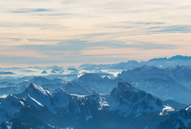 Säntis in Appenzell, Switzerland showcases a stunning landscape dominated by the Swiss Alps. This picturesque location features snow-covered mountains juxtaposed with rocky terrains, creating a striking visual contrast. Hikers often visit this area to experience the pristine wilderness and enjoy panoramic views that stretch across the alpine valleys.
