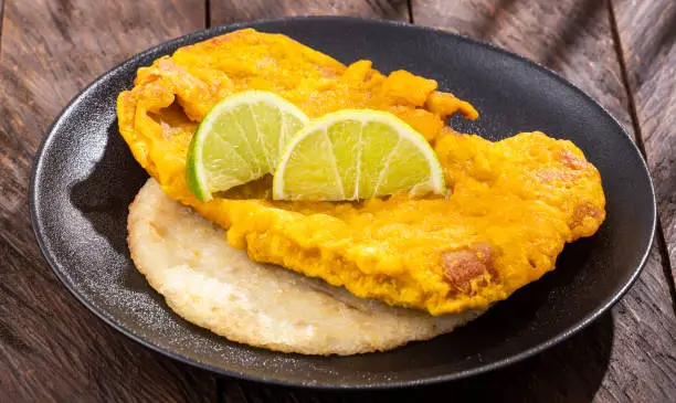 Photo of Rich fried dried fish torta - Traditional Colombian dish