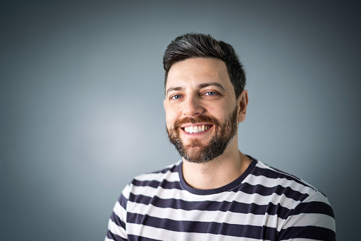 Portrait of young beard man isolated vivid background