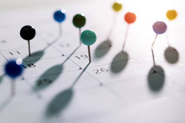 istock Colored pins on the calendar 1421749691