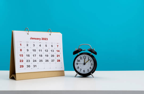 istock 2023 calendar and clock on the table 1421749753