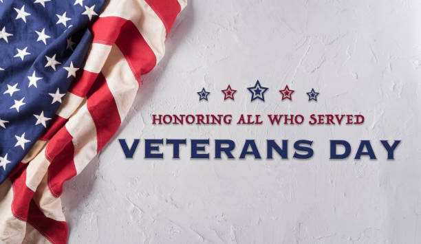 istock Happy Veterans day concept made from American flag and the text on white stone background. 1421749849