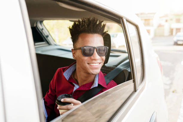 istock Young businessman arriving to work by app car 1421756435