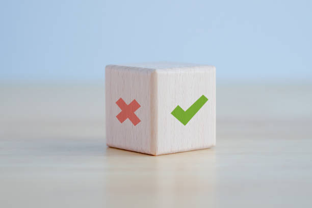 istock Green correct check mark and red wrong or cross icon on wooden block for true or false changing mindset or way of adapting to change leader and transform quiz answer and poll concept. 1421757908