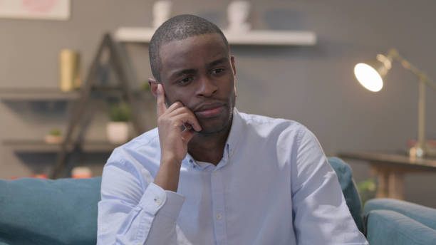 istock Portrait of Pensive African Man Thinking 1421763673