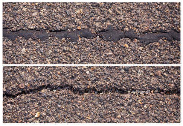 Crack across asphalt walkway.