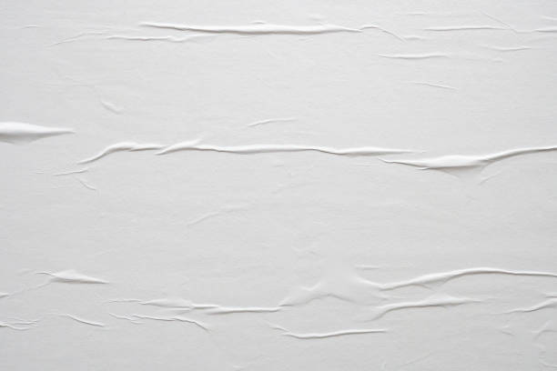 istock white crumpled and creased paper poster texture background 1421771605