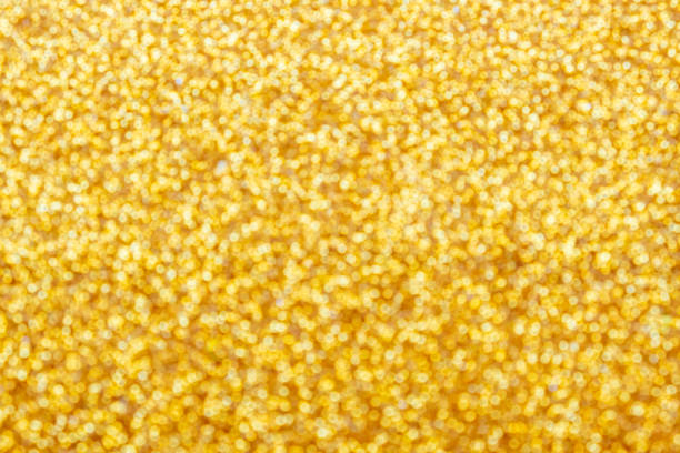 istock Gold light shiny bokeh abstract blur background with bright round defocus golden pattern 1421771724