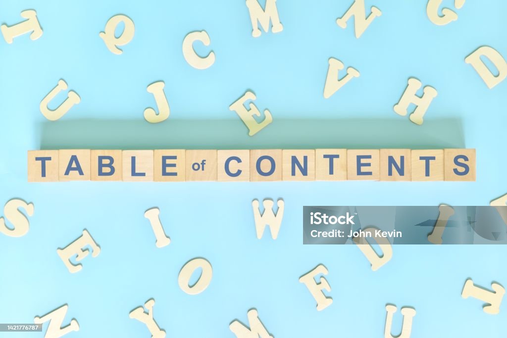 Table of contents part of a book concept. Wooden blocks typography word flat lay in blue background. Table Of Contents Stock Photo