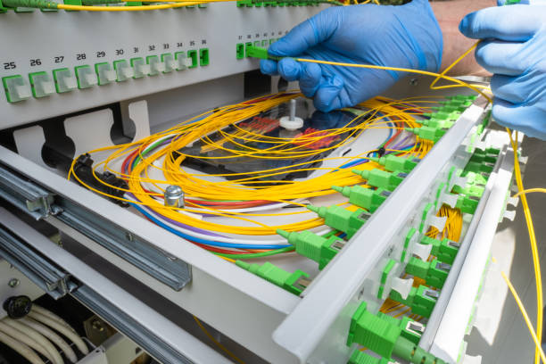 istock Telecommunication Equipment, Technician Switching Fiber Patch Cord 1421779819