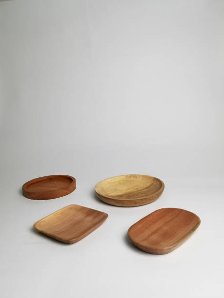 istock wooden plate handcrafted isolated on white background 1421780819