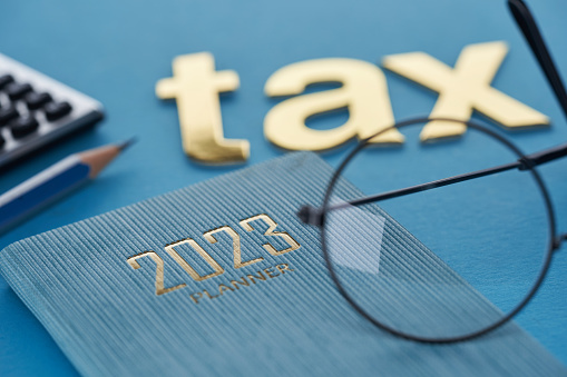 single word tax with 2023 calendar and calculator