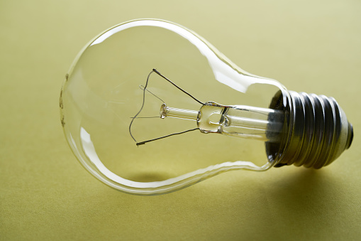 light bulb against yellow background