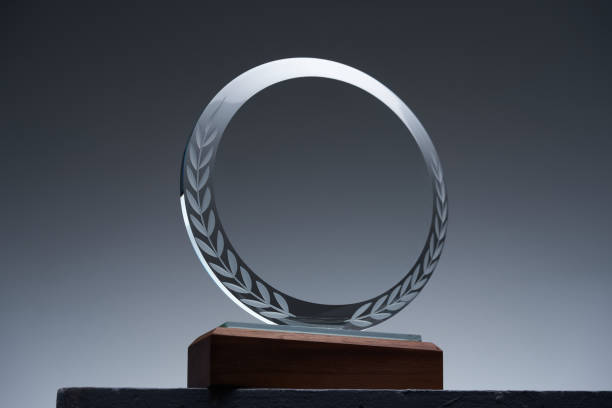 istock glass trophy on gray background 1421785718