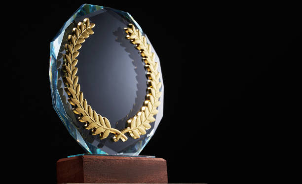 glass trophy against black background