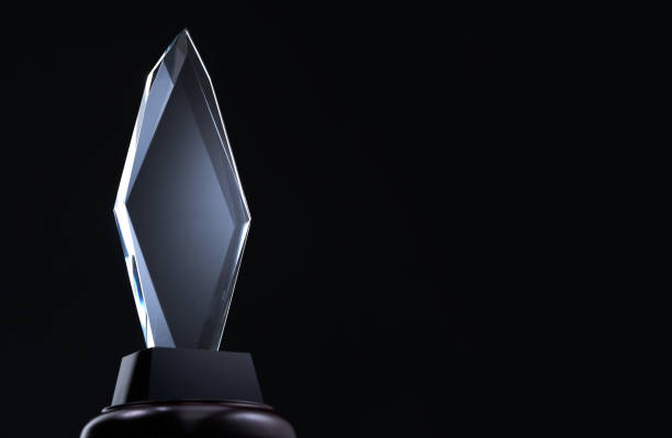 diamond shape crystal trophy against black background