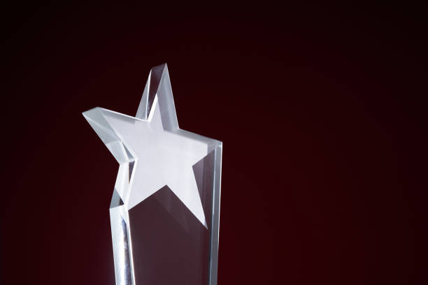 istock star shape crystal trophy against red background 1421786203
