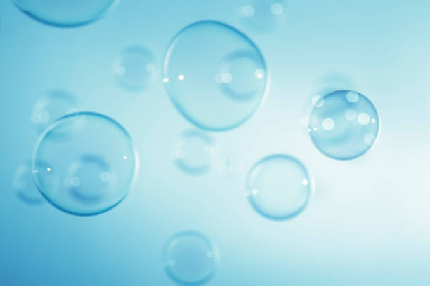 istock bstract Beautiful Transparent Blue Soap Bubbles Background. Soap Sud Bubbles Water. 1421790595